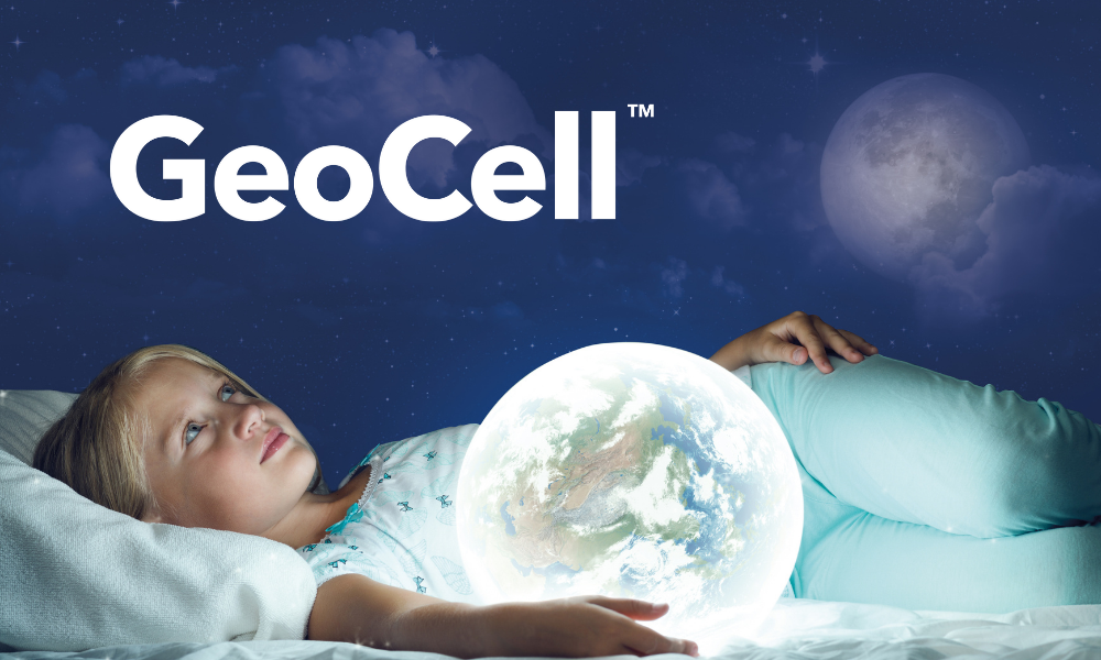 Person lying on a mattress holding a glowing Earth, symbolizing GeoCell™ additives for sustainable “Mattress in a Box” foam solutions.