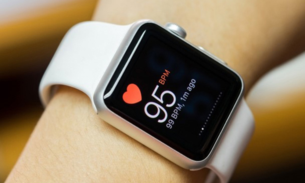 Close up white smart watch with health app icon on the screen