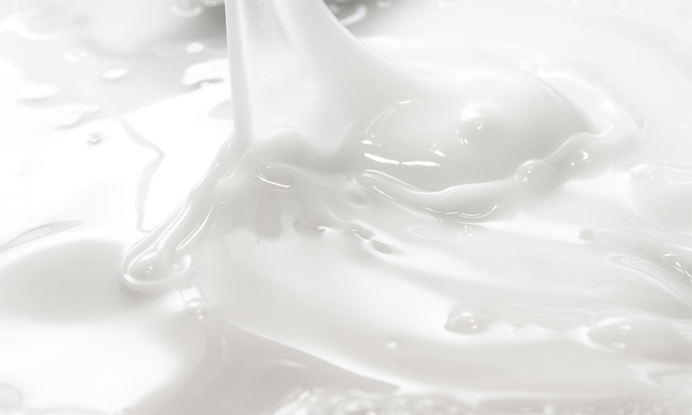 Close-up of white silicone emulsion, representing Momentive’s Indusil™ organomodified silicones for versatile industrial applications and enhanced performance.
