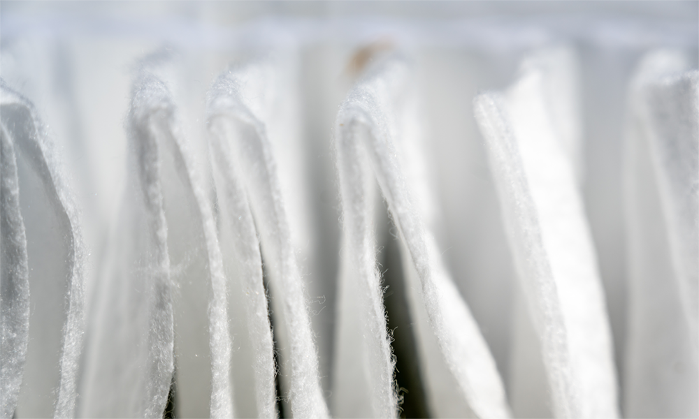 Close-up of nonwoven filters treated with hydrophilic silicone finishes to soften and improve their wettability.