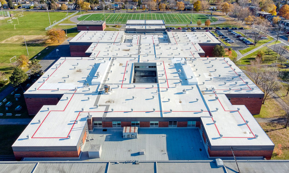 Polybel School in Quebec restored its ageing roof with a silicone coating, extending its service life without full roof replacement 