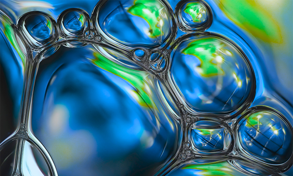 Burbujas azules y verdes para mostrar el concepto de surfactantes de silicona de Momentive