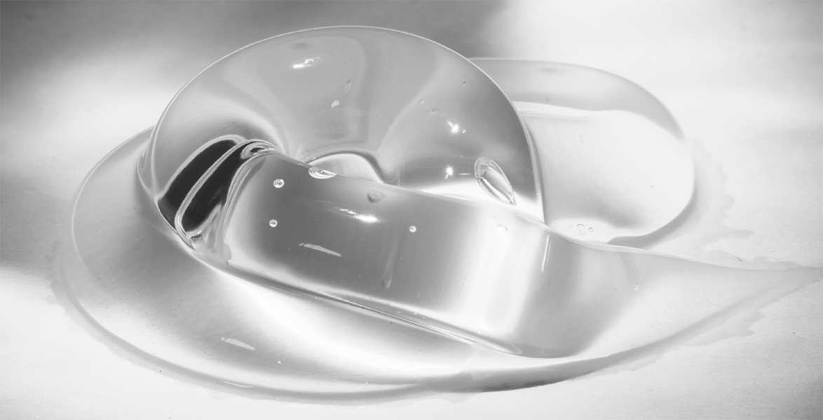 Momentive Mechanical Fluids concept clear liquid with silver background